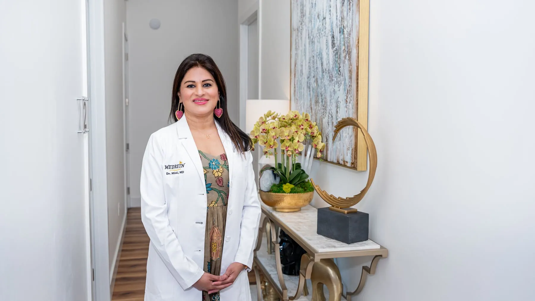 Dr. Haritha Mikkilineni, MD, in her lab coat at the Medrein Health clinic in Southlake, TX
