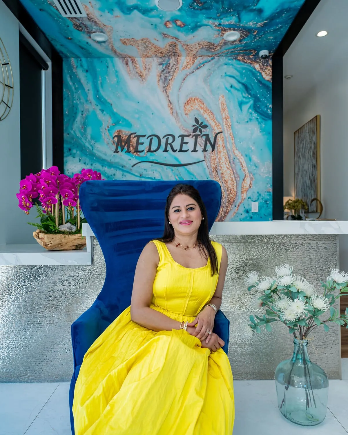 Dr. Haritha Mikkilineni, MD, seated at the Medrein Health clinic in Southlake, TX