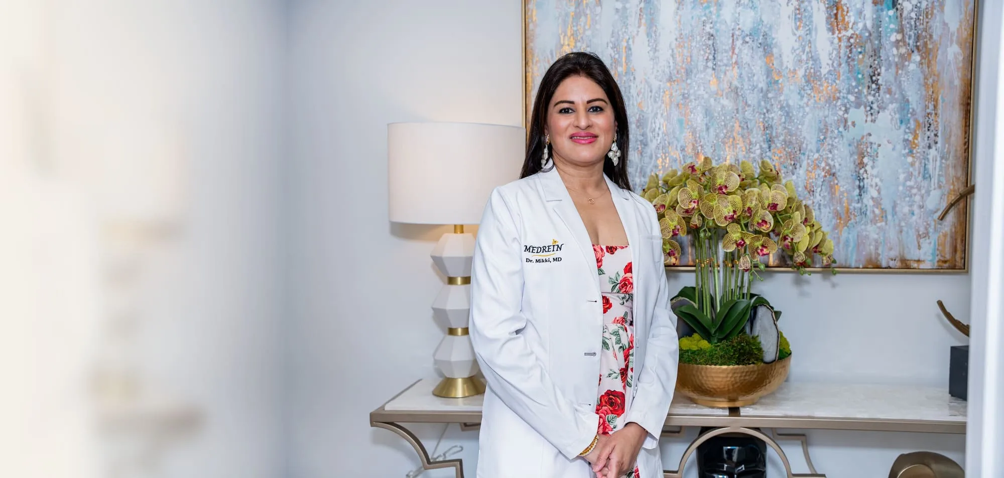 Dr. Mikki in her lab coat at Medrein Health & Aesthetics in Southlake, TX